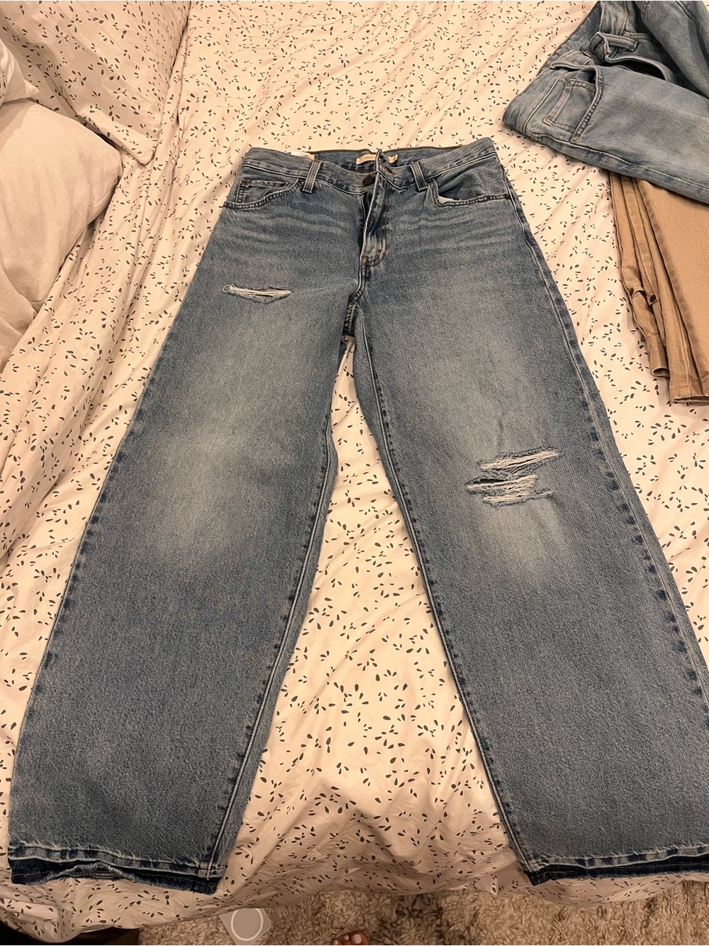Levi’s baggy dad jeans with distressing.  Size 26